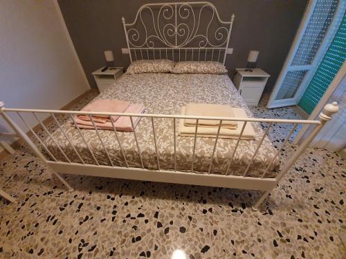 a bedroom with a bed with a metal bed frame at Il Tamburino Lucio in San Gemini