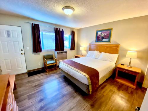 Ένα ή περισσότερα κρεβάτια σε δωμάτιο στο Silver Star Motel