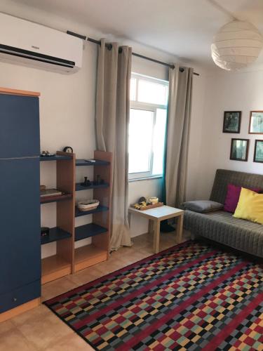 a living room with a couch and a table at Casas Botelho Elias in Pinhão