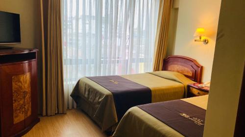 Cama o camas de una habitación en Hotel Continental Lima