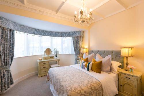a bedroom with a bed and a window at Warkworth House Hotel in Warkworth
