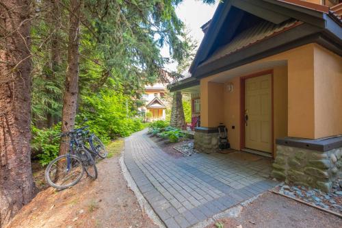 a bike parked in front of a house at Sunpath by Outpost Whistler in Whistler