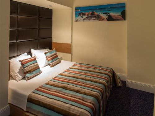 Säng eller sängar i ett rum på Address Residence Suite Hotel