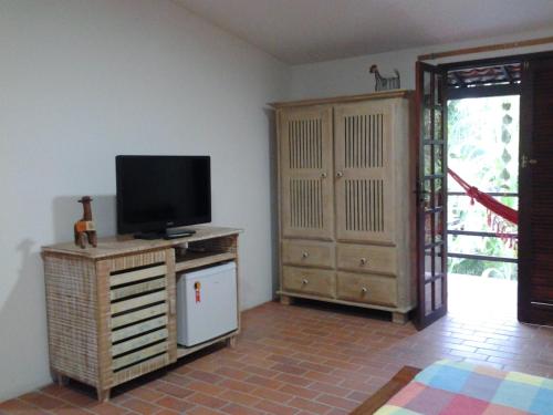 A television and/or entertainment centre at Exclusive Guest House