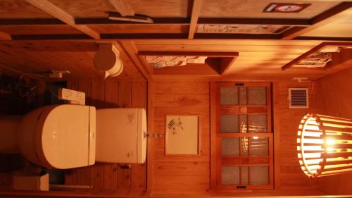 a room with a refrigerator and a door in a room at Nagoya - House - Vacation STAY 7563 in Nagoya