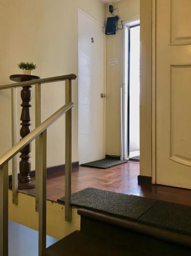 a hallway with a door and a stairway with a door at Lima Mini Aparts Monterrico - Cerca Embajada EEUU in Lima