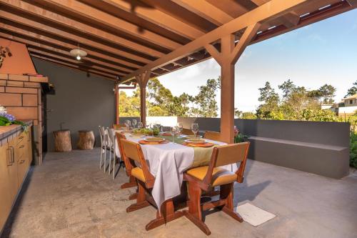 a table and chairs on a patio at Quinta Frizado in Prazeres
