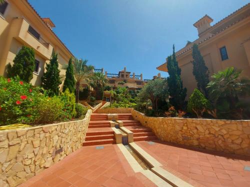 a set of stairs in front of a building at Apartamento de lujo cerca de La Isla del Fraile in Águilas