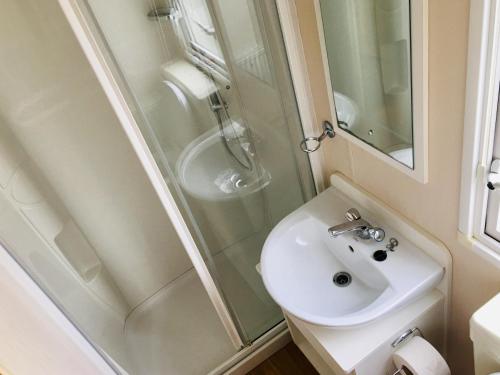 a bathroom with a sink and a shower at Luzern’s Heaven in Clacton-on-Sea