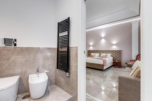 Postel nebo postele na pokoji v ubytování UnoSeiTre - Luxury Apartment & Suite