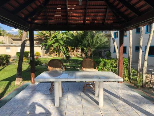 two chairs sitting around a table on a patio at La Gaviota A3 in Juan Dolio