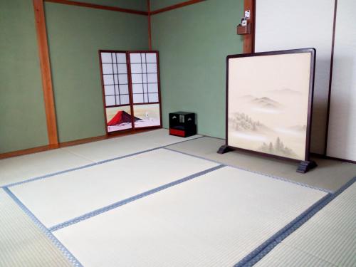 TV a/nebo společenská místnost v ubytování Kyoto Villa Kotone