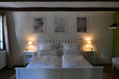 a bedroom with two beds and two lamps on tables at Ferienhaus 7. Kaiser in Quedlinburg