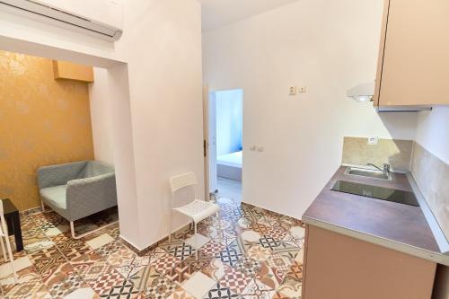 a kitchen with a sink and a counter top at Stanford Aparthotel Gara de Nord in Bucharest