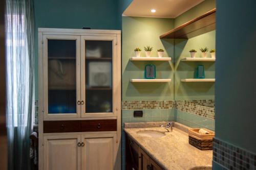 a bathroom with a sink and a medicine cabinet at La Casolicchia di Arona in Arona