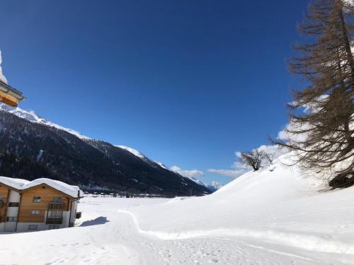 a cabin in the snow on a mountain at Chalet Breithorn- Perfect for Holiday with Amazing View! in Obergesteln