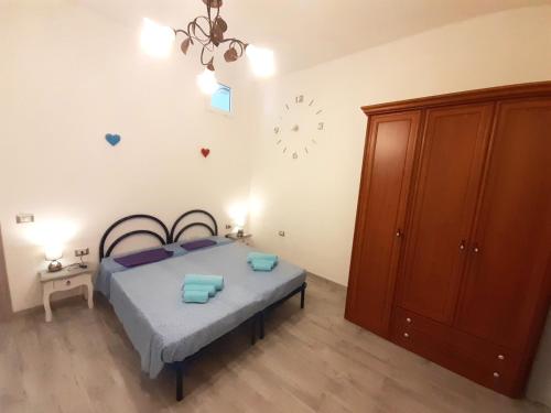 Ένα ή περισσότερα κρεβάτια σε δωμάτιο στο OLBIA CENTER VIA ROMA 22