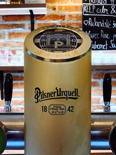 a wine barrel with a label on top of it at Hotel & Apartments U Černého orla in Třebíč