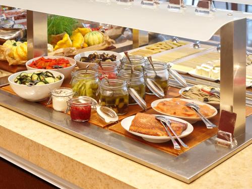 a buffet line with many different types of food at Monte Mulini Adults Exclusive Hotel by Maistra Collection in Rovinj