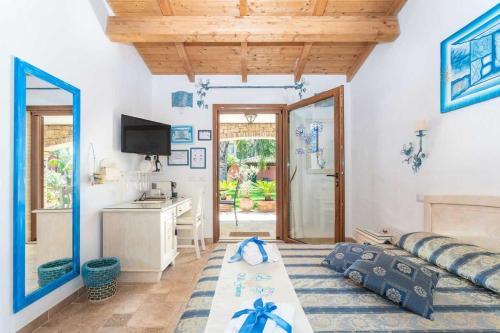a living room with a couch and a table at Villa Flumini in Flumini di Quartu