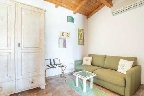 a living room with a couch and a table at Villa Flumini in Flumini di Quartu