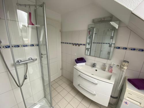 a bathroom with a shower and a sink at Haus Petersen in Undeloh