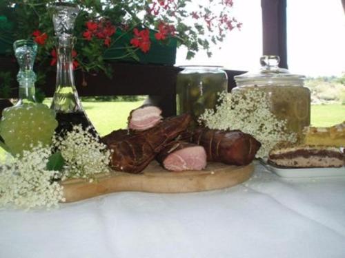 a table with a plate of food on a table at Siedlisko Sabinowo in Węgorzewo