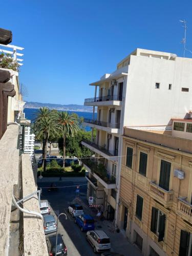 a view of a street in a city with buildings at White Rooms in Reggio Calabria