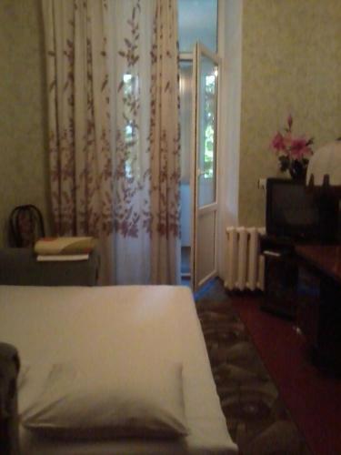 Postel nebo postele na pokoji v ubytování Квартира в центре.