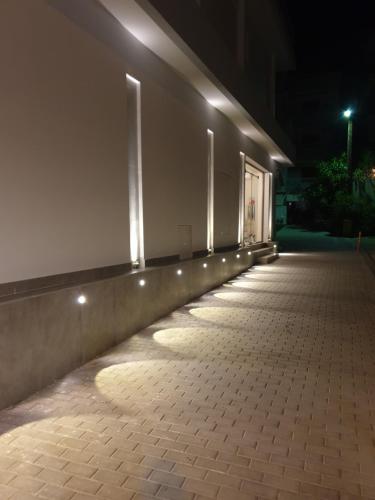 an empty hallway with lights on the side of a building at ANGELO Cafe Hotel in Tolo