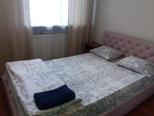 Ένα ή περισσότερα κρεβάτια σε δωμάτιο στο Nuri Hotel Стадион