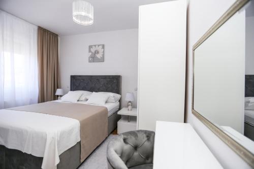 Postel nebo postele na pokoji v ubytování APARTMANI GUTO