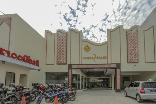 a group of motorcycles parked in front of a mall at RedDoorz Plus near Solo Paragon Mall in Bonorejo