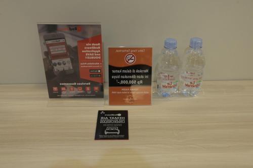a group of bottles of water sitting on top of a table at RedDoorz Plus near Solo Paragon Mall in Bonorejo
