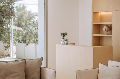 a living room with a couch and a window at Miramare Blue Stay in Torre Santa Sabina
