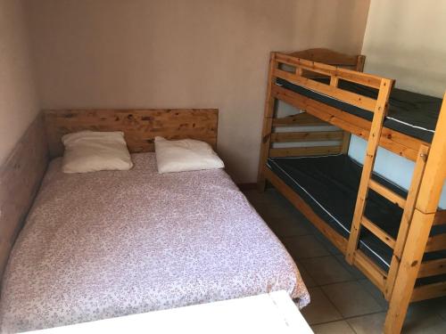 Postel nebo postele na pokoji v ubytování Le Serre Chevalier Maison Familiale