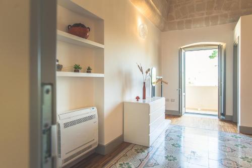 a living room with a radiator and a window at Masseria Gagliardi in Taranto