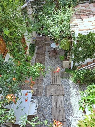 a garden with a bunch of plants on the ground at Marakasa B&B in Sant Antoni de Calonge