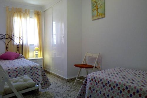 Posteľ alebo postele v izbe v ubytovaní Fabulosa casa de Vacaciones junto al mar
