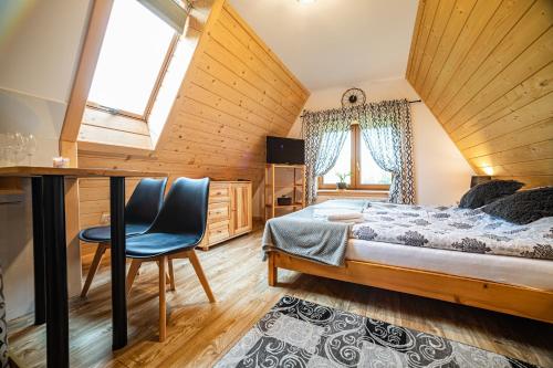 Posteľ alebo postele v izbe v ubytovaní Apartament Stary Mlyn