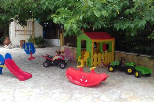 a group of childrens play equipment in a yard at Yria Suite Zakynthos in Katastárion