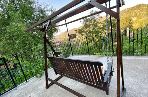 a swing in front of a black fence at Arhontiko Askas Mansion in Askas