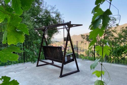 a swing sitting on top of a patio at Arhontiko Askas Mansion in Askas