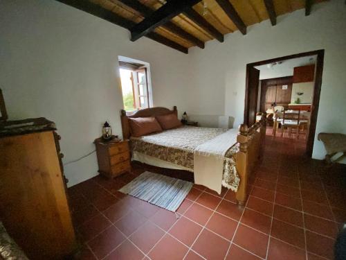 a bedroom with a bed and a large mirror at Arhontiko Askas Mansion in Askas