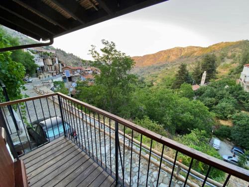 a balcony with a view of a mountain at Arhontiko Askas Mansion in Askas