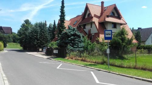 a house on the side of a street at zielony zakątek in Nowy Targ