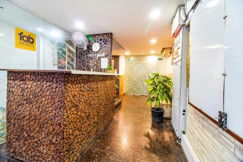a room with a wall made out of wood at FabHotel A 97 in New Delhi