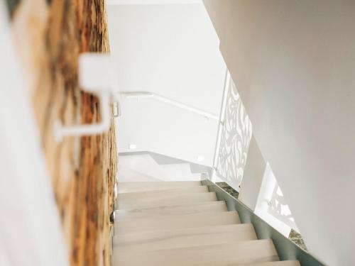 a staircase in a building with a stair case at Kaszubskie Zacisze in Władysławowo