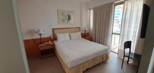 Postel nebo postele na pokoji v ubytování Casa Del Mar