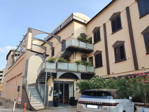 a building with a car parked in front of it at Hotel San Giorgio in Bergamo